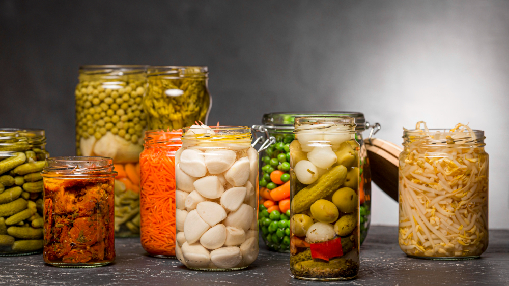 front-view-assortment-vegetables-pickled-clear-glass-jars