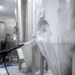 Industrial tank washing procedure highlighting CTC Volc cleaner uses