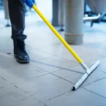 Professional industrial floor cleaning using tile cleaning chemicals for heavy stains in the UAE